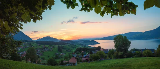 Foto op Canvas view over spa town Krattigen, lake Thunersee, in the evening © SusaZoom