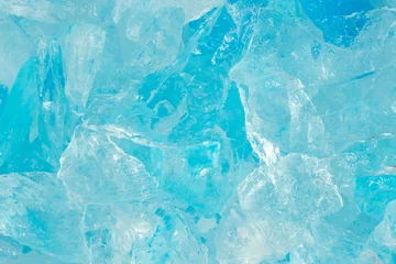 Fotobehang broken ice close up. pieces of crushed blue ice cracks background texture. close-up frozen water. © Илья Подопригоров