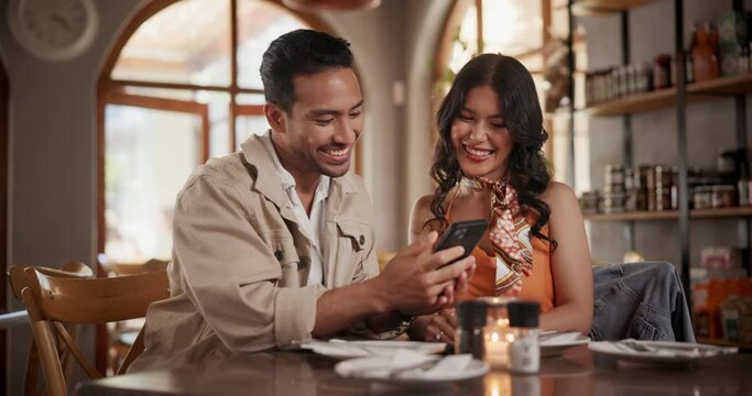 Selfie, dating and couple chatting in restaurant together for love, romance or anniversary celebration. Photograph, happy or conversation with man and woman at romantic dinner for valentines day date