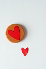 wooden hearts on round wooden objects