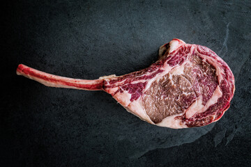 Wagyu tomahawk steak on a slate background - 738809595