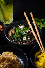 Japanese food. Miso soup. on a black wooden background.