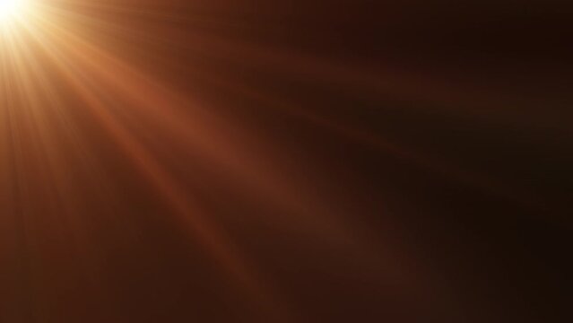 Loop of rays glow orange gold optical flare shine  light from the top left animation on black abstract background for screen project overlay. Side diagonal light optical lens flares shiny animation ar