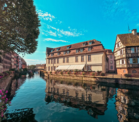 Looking out over a canal to historical medieval architecture in Strasbourg, France on a beautiful...