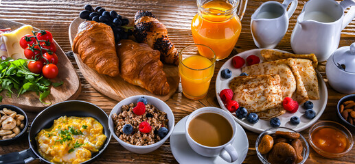 Breakfast served with coffee, eggs, cereals nd croissants