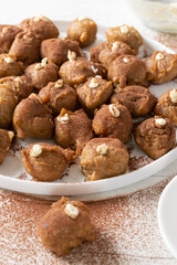Easy and delicious Italian Tiramisu fritters on white background.
