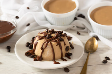 Coffee Panna Cotta dessert, traditional Italian panna cotta recipe on white background.