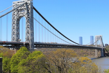 The George Washington Bridge crosses over the Hudson River from New Jersey to The Bronx New York