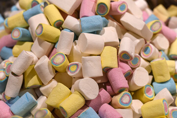 Multi-colored marshmallows in the store. Background or texture of colorful pastel marshmallows.