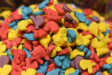 multi-colored candies for sale on a shop window. Sweet shop. Multicolored sweets for children