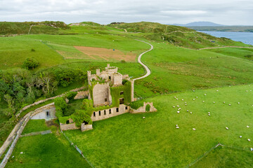 Aerial view of Clifden Castle, ruined manor house, on famous Sky Road near Clifden town, great example of Gothic Revival architecture, history, heritage of Connemara Co. Galway, Ireland