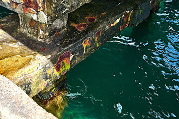 Abandoned pier. Corrosion of reinforced concrete.