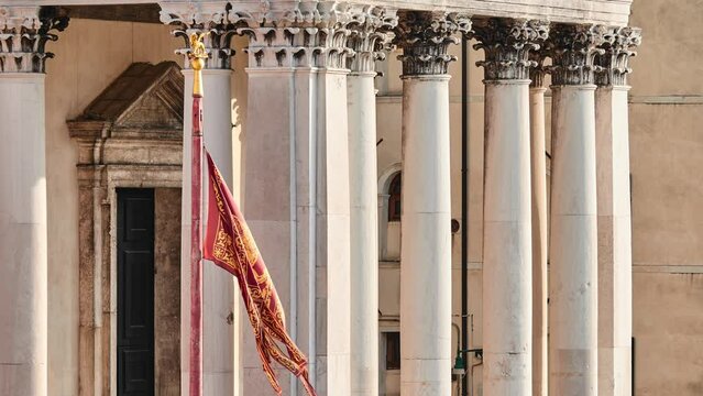 Flag of Venice and San Simeone Piccolo in sestiere of Santa Croce in Venice, Italy