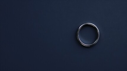 Minimalist Silver Ring on Navy Blue Background Wide Angle Lens