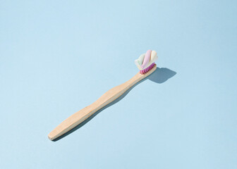 Toothbrush, twisted candy toothpaste, creative concept, daily dental care.