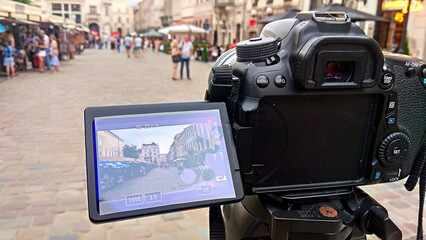 A black camera takes a close-up view of a street in Lviv	
