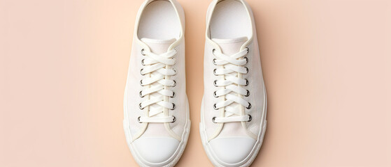 A minimalist shot of spotless white sneakers standing on a simple background, exhibiting timeless elegance.