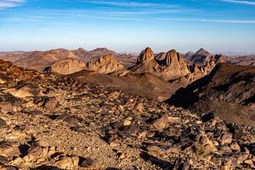 Hoggar landscape in the Sahara desert, Algeria. A view of the mountains and basalt organs that stand around the dirt road that leads to Assekrem. - 738858131