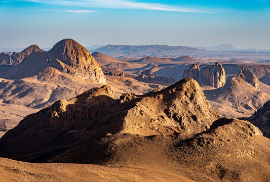 Hoggar landscape in the Sahara desert, Algeria. A view of the mountains and basalt organs that stand around the dirt road that leads to Assekrem.