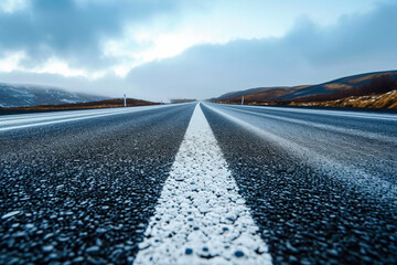 road with a gray color and a asphalt shape and a freight overlay on the lane