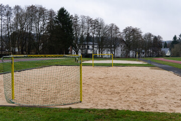 Football game. Football goal with a net. Beach Soccer