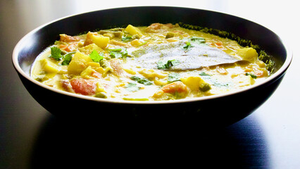 Potato curry vegetarian meal on dark background