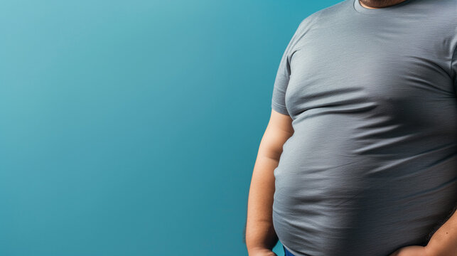 overweight man in tight t-shirt on a light blue background
