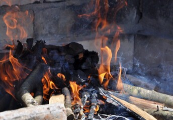 Vintage fireplace. Warm Hearth taken closeup. Garden fireplace with a chimney, made of old bricks,...