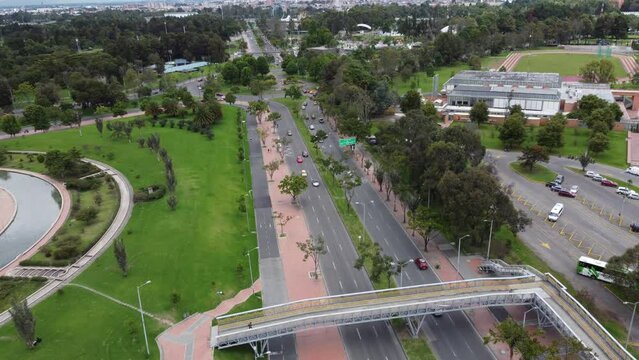 Drone shot of vehicle avenue connected to a roundpoint, Bogota city, Colombia, Latin America