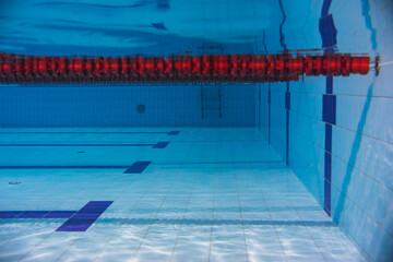 Path in a empty sports swimming pool, underwater photo.