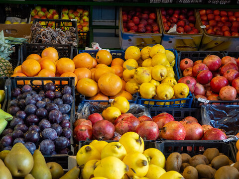 Fruits at the eastern market. Fruits in boxes for sale. The atmosphere of an oriental bazaar
