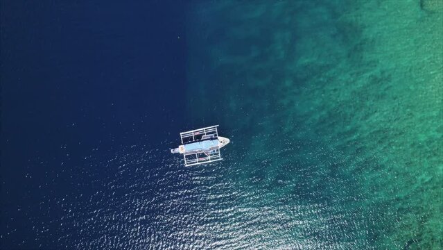 Aerial view of dive boat over coral reef in leyte / Philippines
