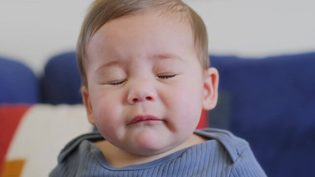 Baby boy sneezes and sprays boogers out of his nose