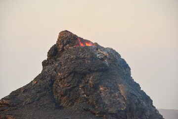 Erta Ale is a chain of volcanoes located in the Afar Triangle, Ethiopia. Here the Earth is...