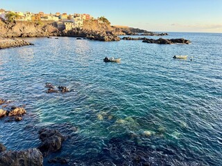 Peaceful bay of Alcala village on the Southern coast of Tenerife, blue calm ocean water with the...