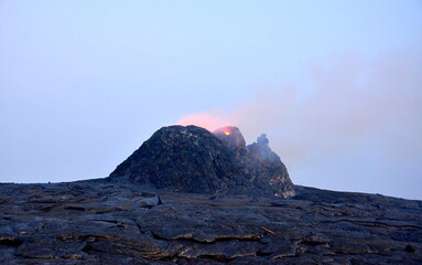 Erta Ale is a chain of volcanoes located in the Afar Triangle, Ethiopia. Here the Earth is...