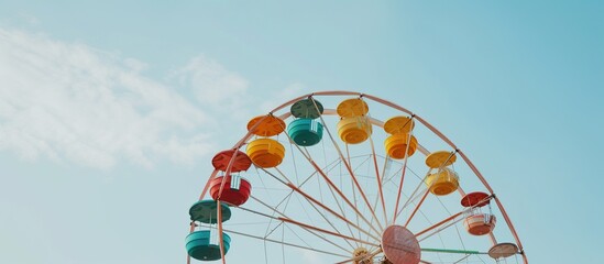 a colorful ferris wheel spinning against the sky in the background