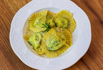 Serving Homemade Pasta Ravioli with Cow Butter Sauce