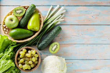 Green Fruits and Vegetables on Vintage Painted Boards, Copy Space