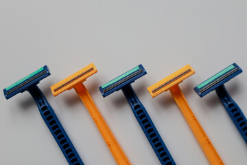 Row of manual shaving tools on a white background