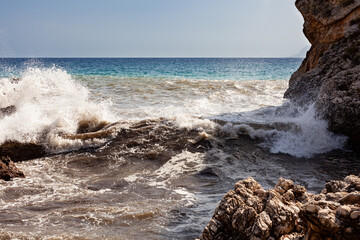 Waves breaking over rocks in Sicily - 738921548