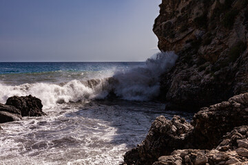 Waves breaking over rocks in Sicily - 738922197