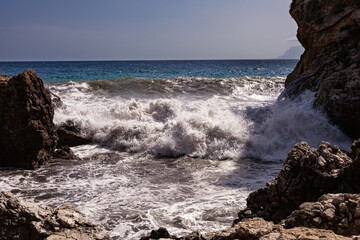 Waves breaking over rocks in Sicily - 738922355