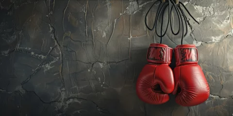 Tuinposter New red boxing gloves hanging on wall © InfiniteStudio