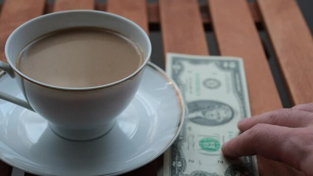 cup of coffee with money