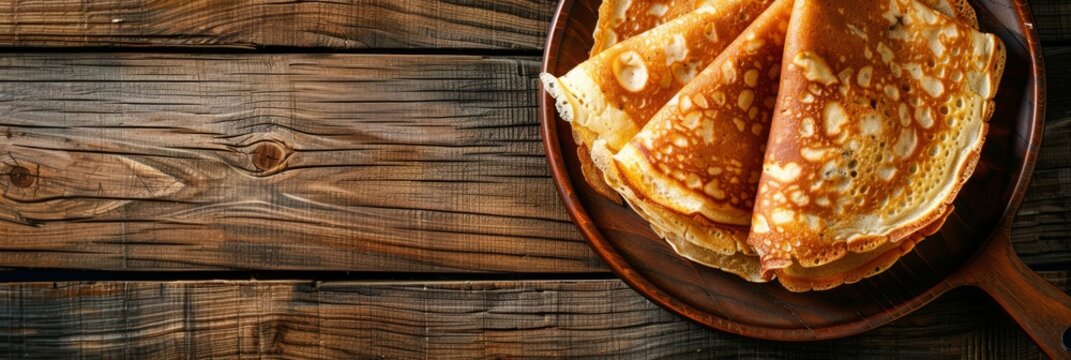 Russian thin pancakes on wooden background. Pancake Day, Maslenitsa, Shrovetide. Slavic national festival. Design for banner, header, invitation, card with copy space. Flat lay, top view