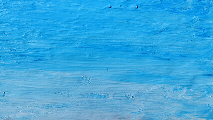 Blue strokes of oil paint. Stock background with touches of creativity. Abstract color with drawing texture.
