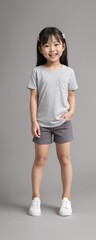 Obraz premium A young and cute child wearing a blank plain t-shirt in a studio photo, perfect for mockups or designing custom shirts as templates