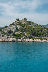 Kekova island landscape,blue water, rocks and bushes