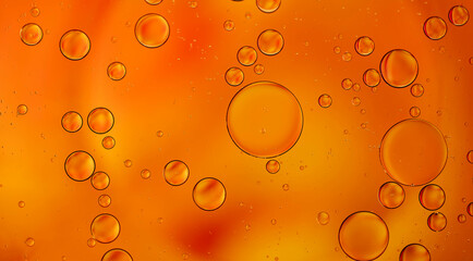 orange bubbles in a glass with drink